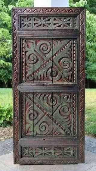 The Pranali Carved Rustic Armoire