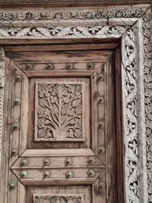 The Jannat Carved Rustic Armoire