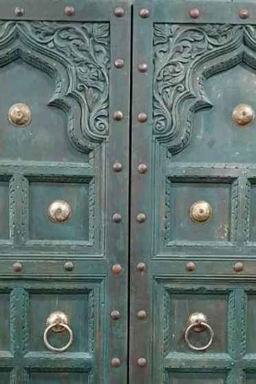 The Jannat Carved Rustic Armoire